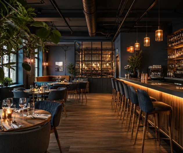 Restaurant and hospitality venue painting project completed by Pro Plaster and Paint in London featuring a modern refurbished dining area