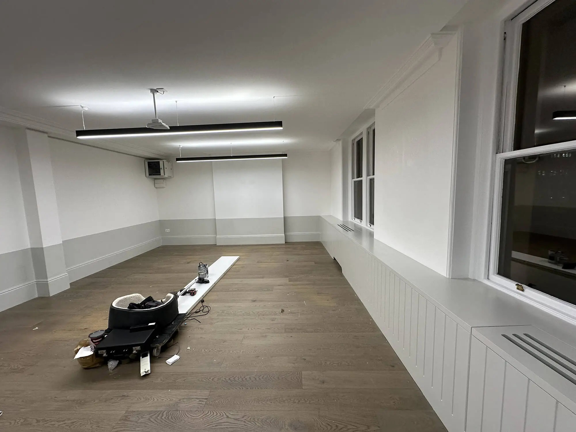 Commercial painters decorating a modern office building in London